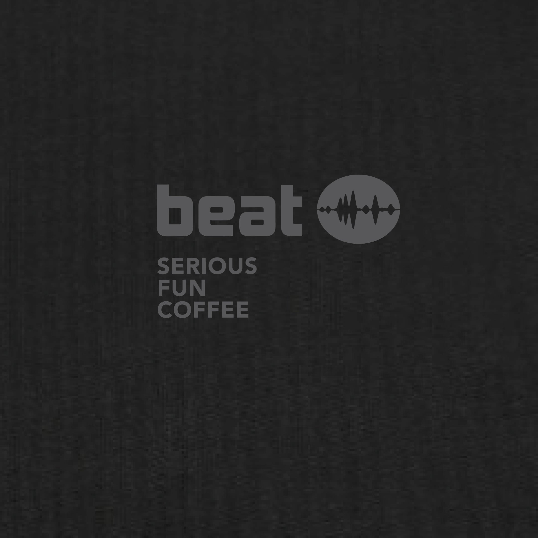 Text 'beat SERIOUS FUN COFFEE' on a textured black background